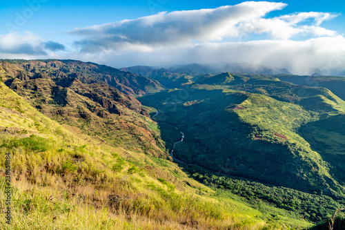 Waimea Canyon view from the first pull out along the road with clouds over the mountain, Kauai, Hawaii photo