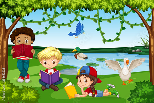 Children reading books in nature