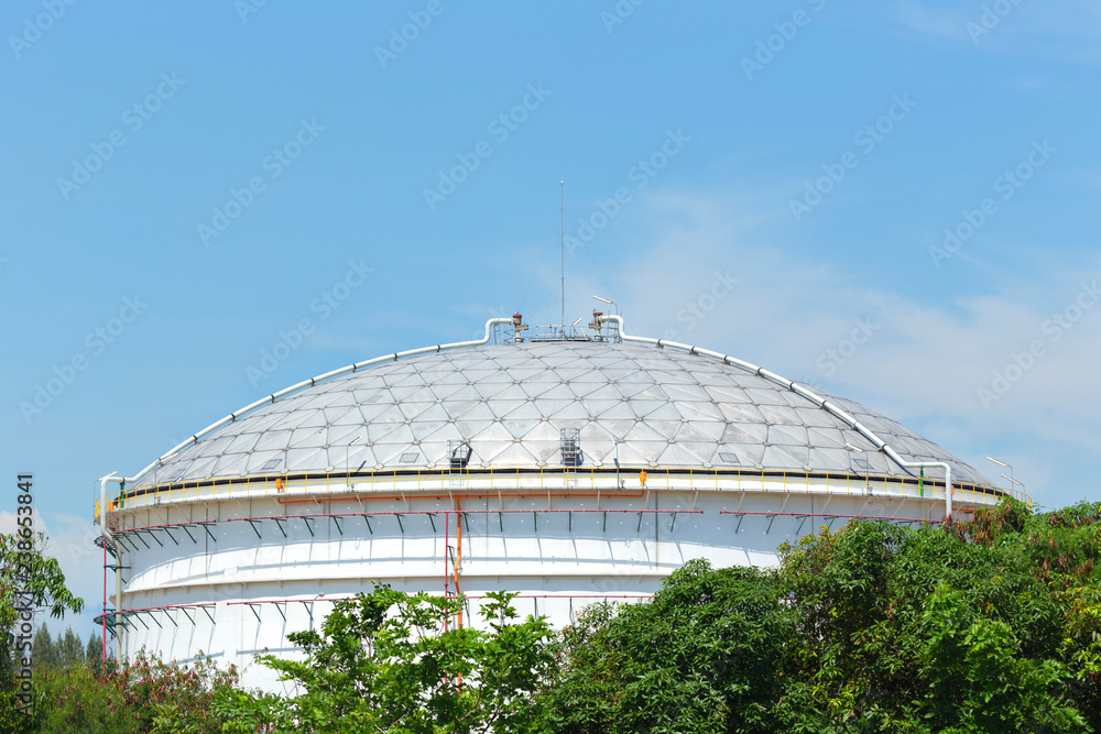Fototapeta premium White large storage tanks under a blue sky. Gasoline, oil, chemical or other storage at factory side.