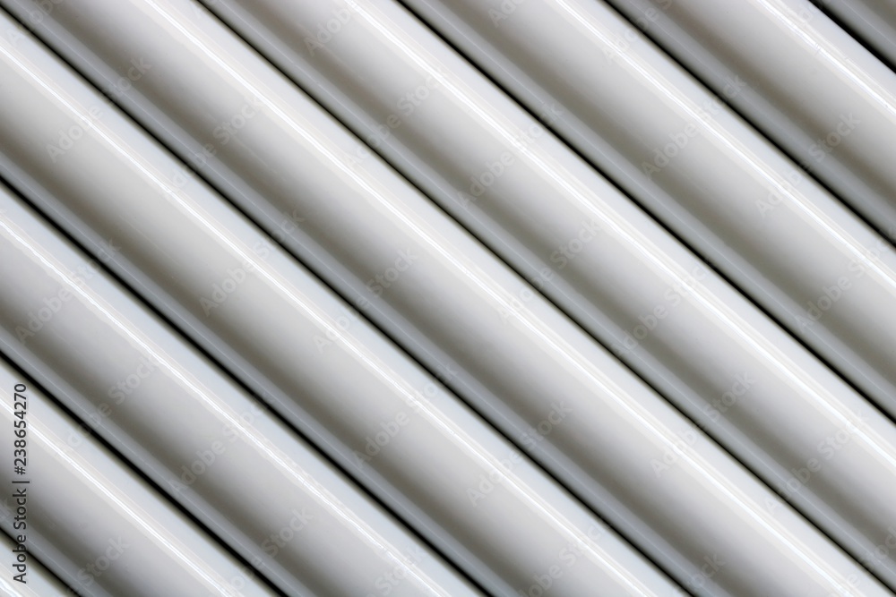 Texture of white steel pipe sort in diagonal, abstract background Texture of white steel pipe sort in diagonal, abstract background