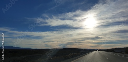 Capture the sundown and its flare on our road trip back from the Grand Canyon with colorful clouds and sky.