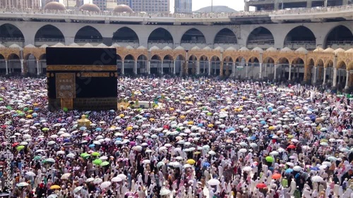 Circumambulation with umbrellas (Tawaf) around 'Holy Kaaba', in Mecca photo