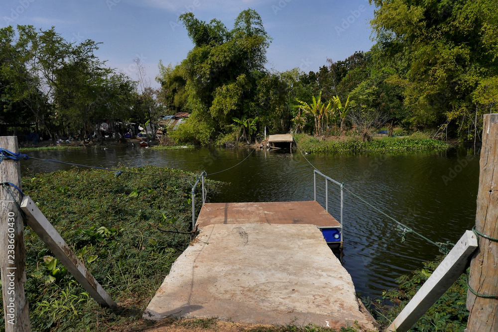 Rope powered ferry platform to a river island. Buriram, Thailand.