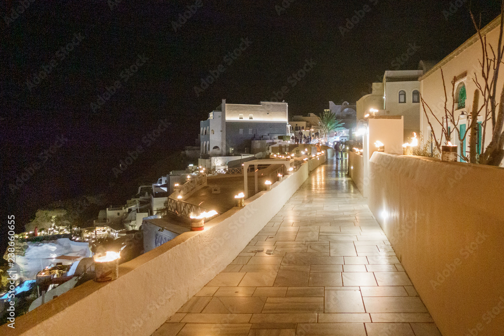 Illuminated classical architecture of Oia town during night; Santorini island; Greece