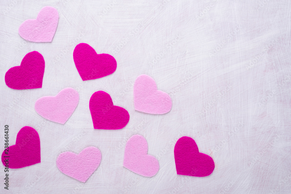 Obraz premium Background with hearts made of pink felt