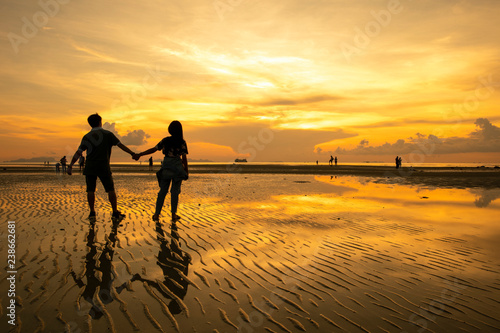 Silhouette of couple lover on the beach