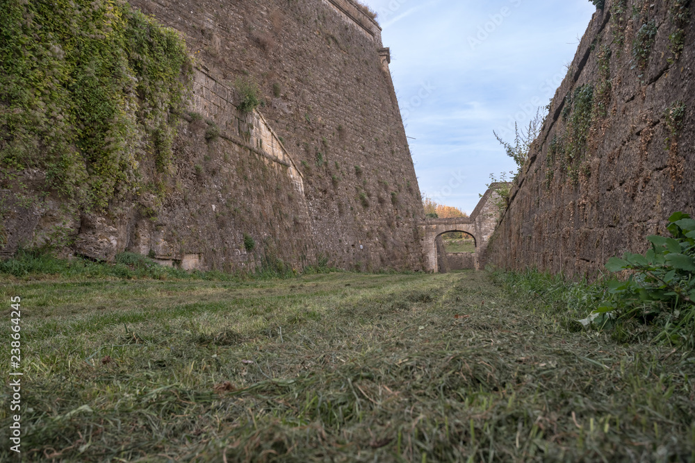 old castle with its high walls around it old castle with its high walls around it
