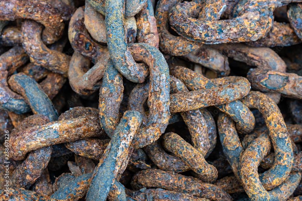 Rusty chains eroded by sea water Rusty chains eroded by sea water