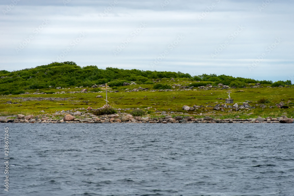 Poklonny cross by the sea on Bolshoy Zayatsky Island. Solovetsky archipelago, White sea, Russia Poklonny cross by the sea on Bolshoy Zayatsky Island. Solovetsky archipelago, White sea, Russia