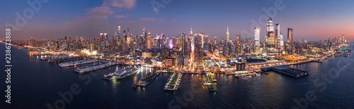Aerial panorama of the entire Manhattan island at dusk