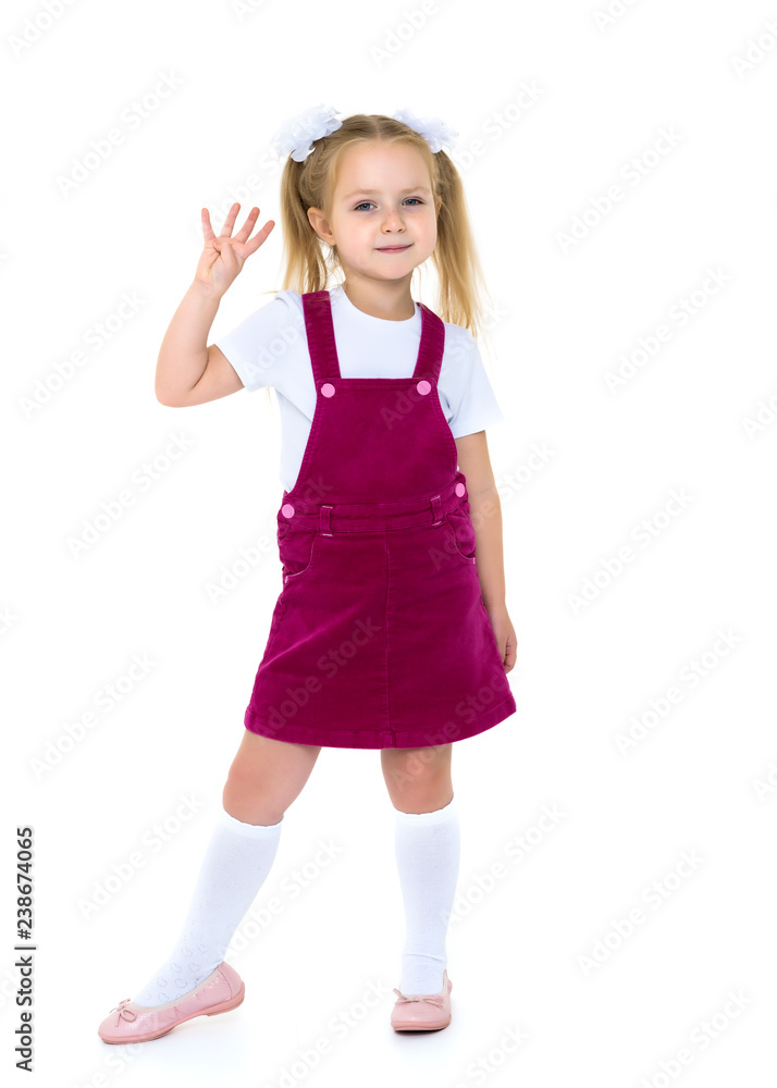 Little girl posing in studio on a white background. Little girl posing in studio on a white background.