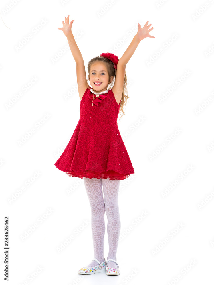 Fototapeta premium Joyful girl with arms raised.