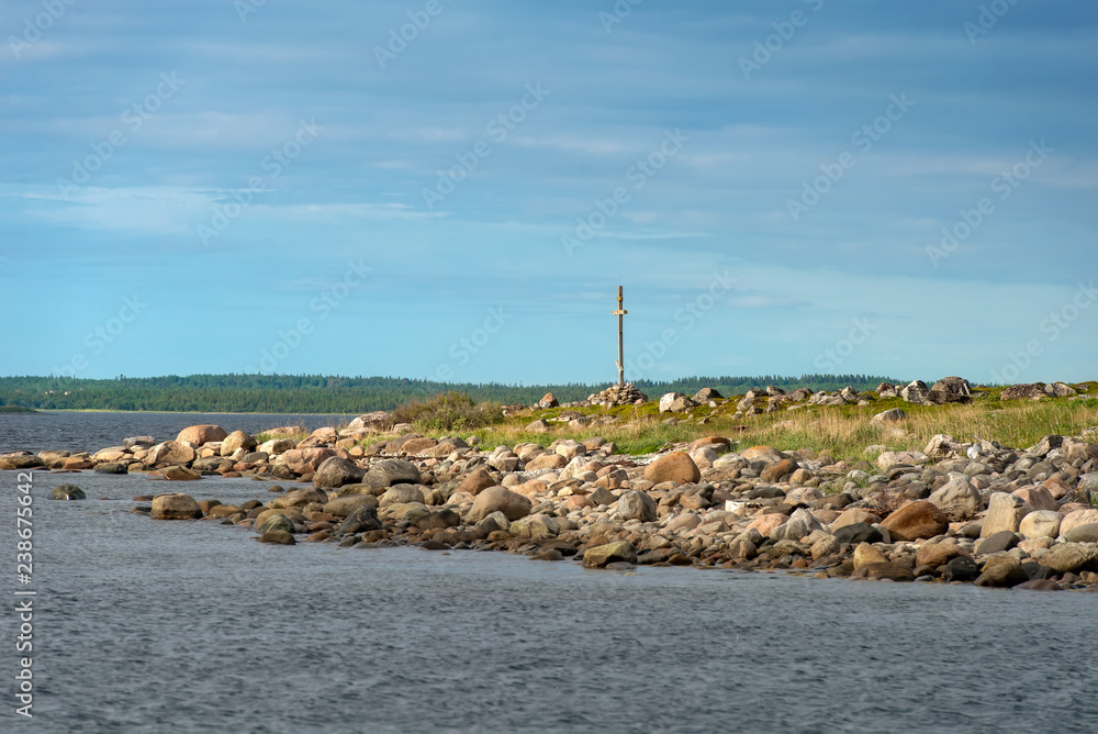 Poklonny cross by the sea on Bolshoy Zayatsky Island. Solovetsky archipelago, White sea, Russia