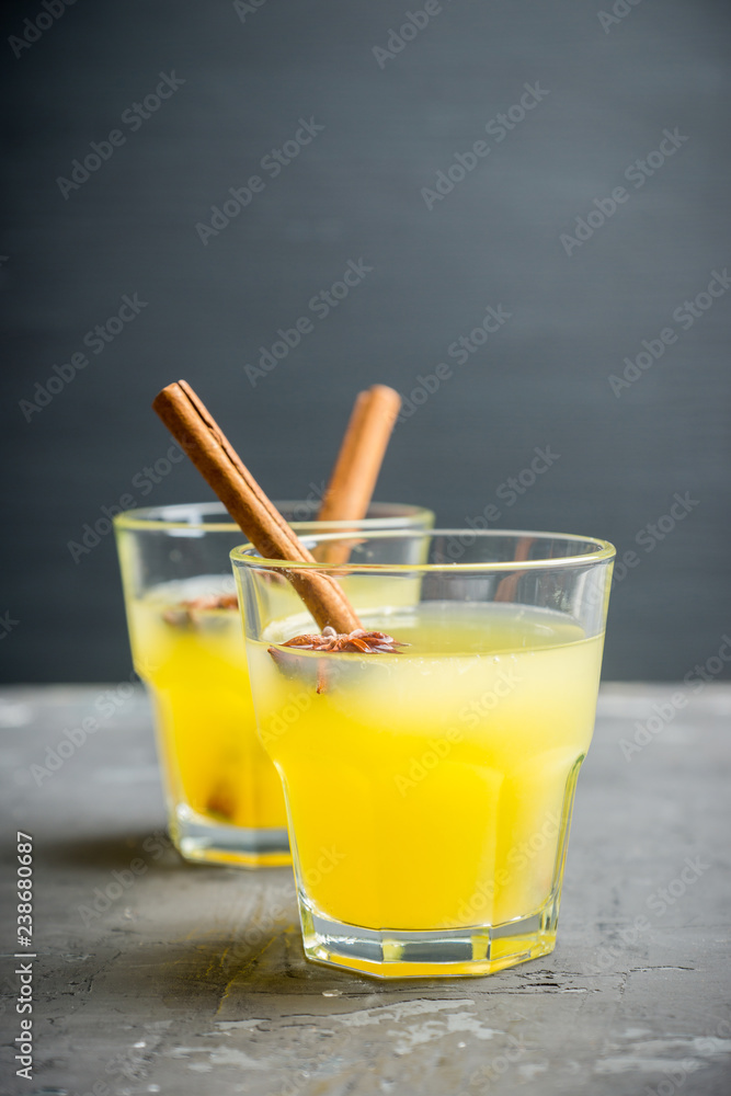 Fototapeta premium Old fashioned citrus beverage with spices. Selective focus. Shallow depth of field.