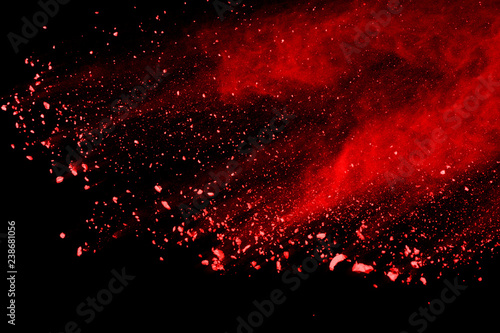 red powder explosion isolated on black background