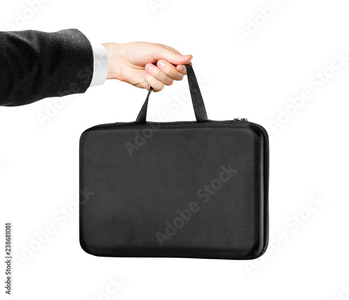 Hands in white shirt and black jacket holding a black case. Isolated on white background