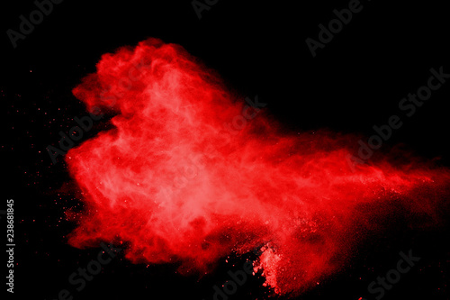 red powder explosion isolated on black background
