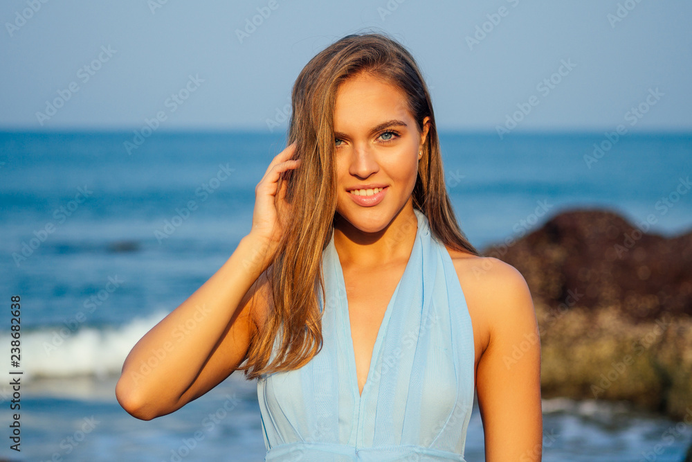woman put spf and sunscreen on face.Portrait of the beautiful girl close-up snow-white smile,blue eyes and perfectly clean skin.female model on the beach happy summertime on shore tropical paradise woman put spf and sunscreen on face.Portrait of the beautiful girl close-up snow-white smile,blue eyes and perfectly clean skin.female model on the beach happy summertime on shore tropical paradise