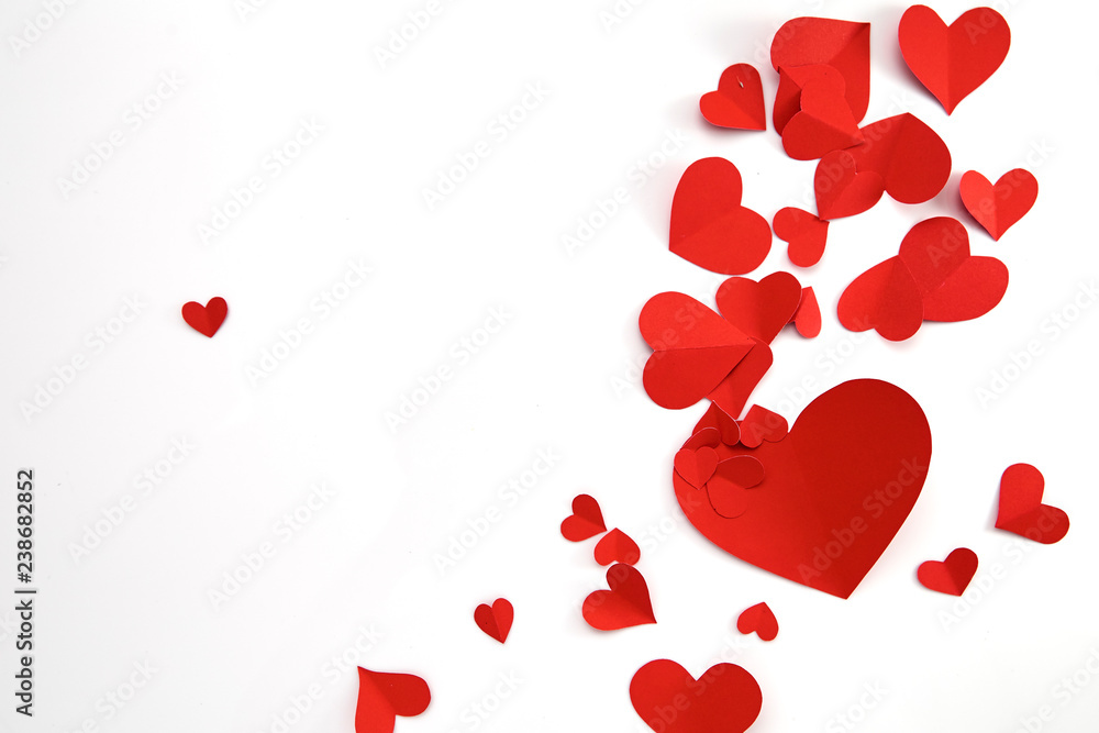 Paper red hearts on white background