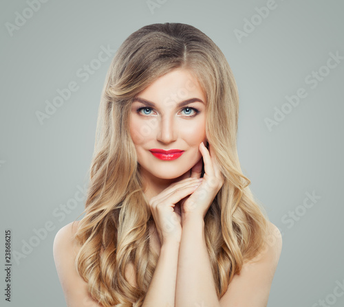 Perfect blonde woman with long healthy hair and clear skin. Beautiful female face. Facial treatment and cosmetology
