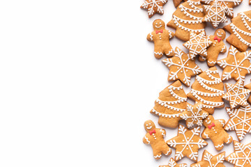 Border of homemade christmas gingerbread cookies on white