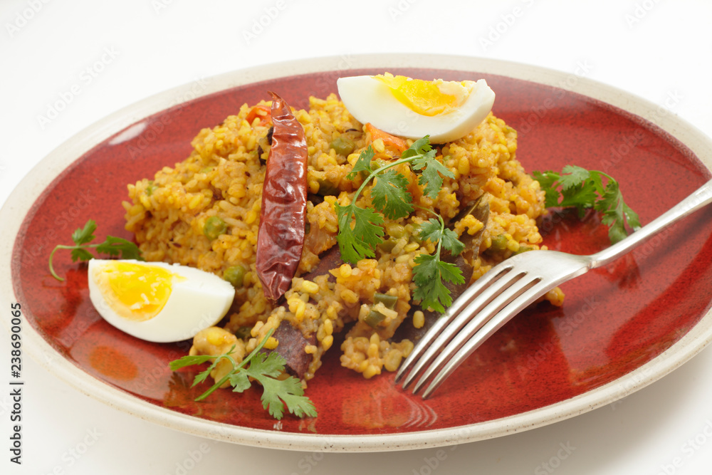 Traditional north Indian Kichuri and boiled egg side view Traditional north Indian Kichuri and boiled egg side view