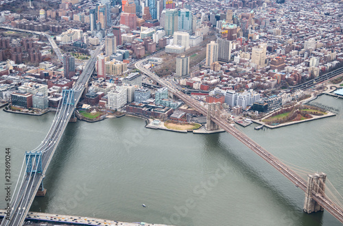Aerial view of Manhattan and Brooklyn Bridge from helicopter, New York City in winter