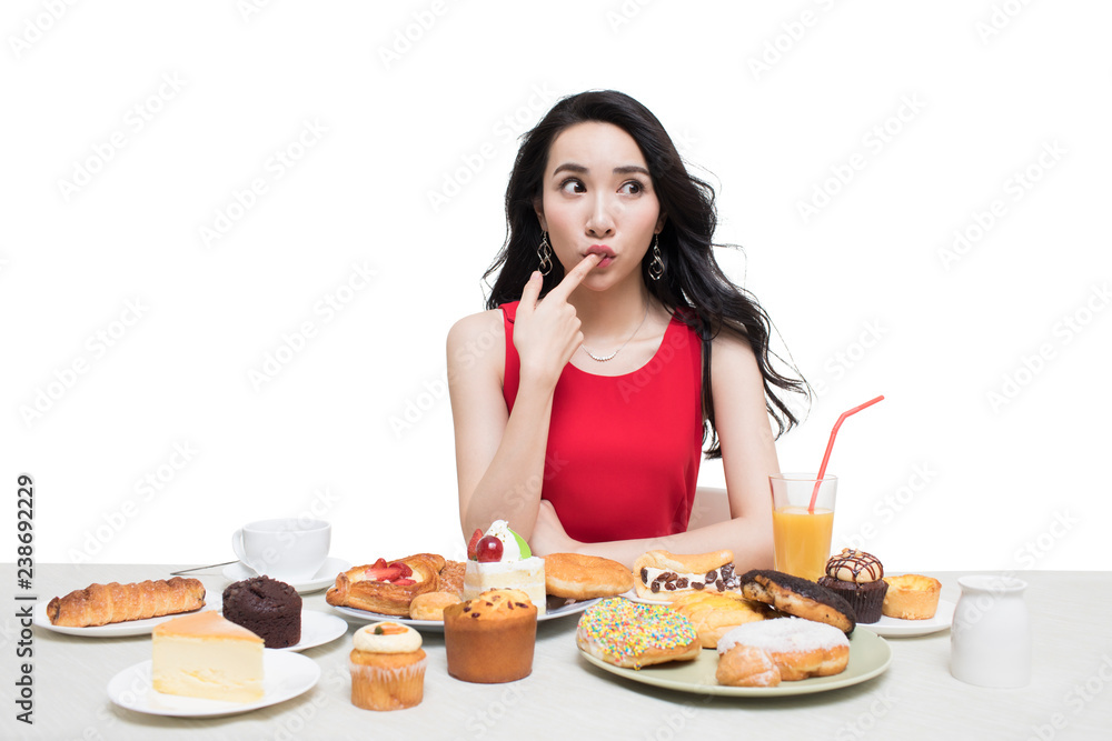 Fashionable young woman eating dessert Fashionable young woman eating dessert