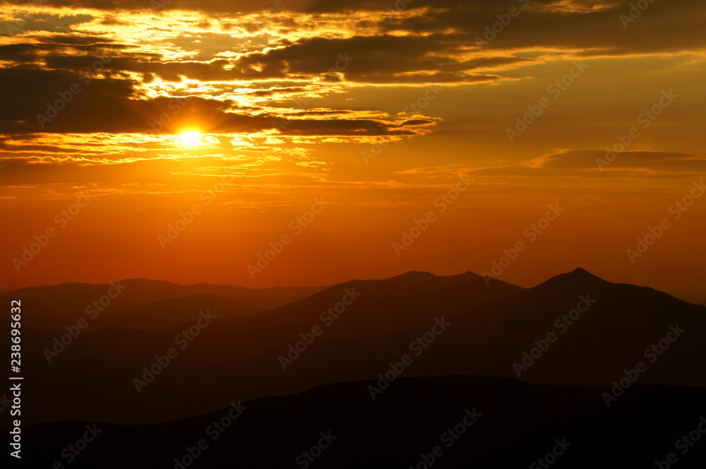 Sun over the mountains. Bieszczady National Park. Poland. Polonina Wetlinska, Polonina Carynska,Tarnica Sun over the mountains. Bieszczady National Park. Poland. Polonina Wetlinska, Polonina Carynska,Tarnica