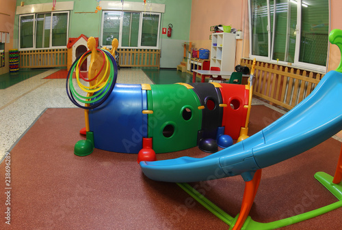 wide hall of a kindergarten with many toys photo