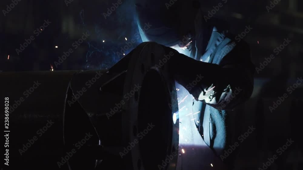 Industrial worker welder weld at factory Industrial worker welder weld at factory