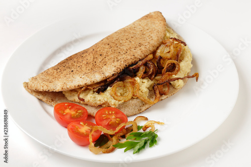 Pitta bread with hommos and onions