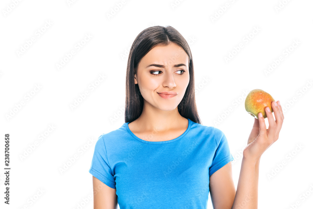 portrait of young woman looking at fresh apple isolated on white portrait of young woman looking at fresh apple isolated on white