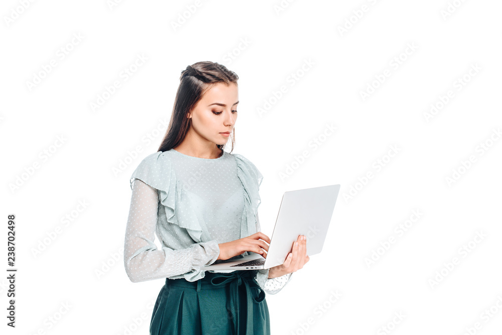 side view of young woman using laptop isolated on white side view of young woman using laptop isolated on white