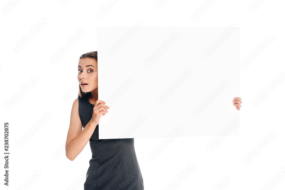 portrait of shocked young woman holding blank banner isolated on white portrait of shocked young woman holding blank banner isolated on white