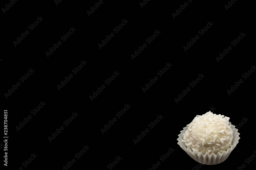 Candy sweet white cream with coconut isolate on a black background