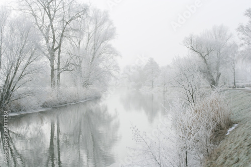 River landscape with fog and rime, the river Nidda in Frankfurt, Germany.