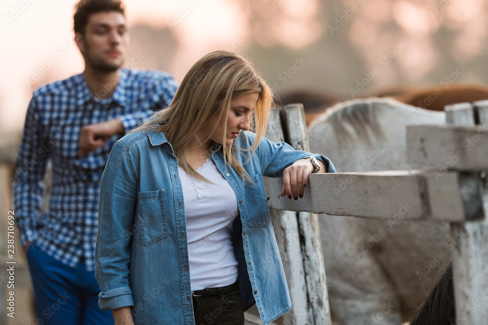 Couple in love enjoy day in nature and horses Couple in love enjoy day in nature and horses