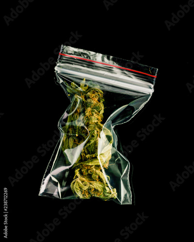 Bags of marijuana on a black background.