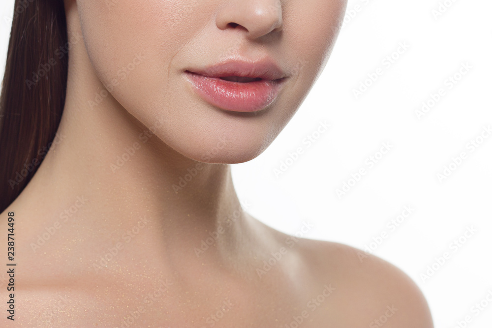 Closeup of beautiful female mouth with natural lip makeup. Closeup of beautiful female mouth with natural lip makeup.