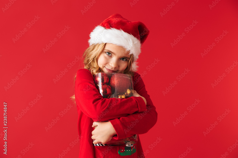 Cheerful little girl wearing Christmas costume Cheerful little girl wearing Christmas costume
