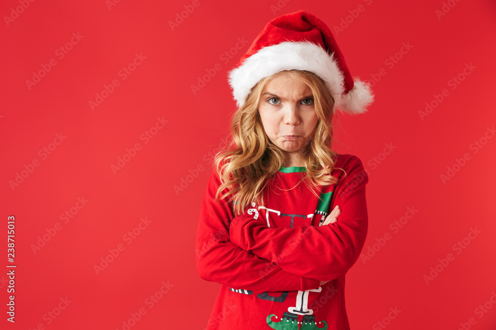 Upset little girl wearing Christmas costume Upset little girl wearing Christmas costume