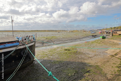 The muddy beach at low tide with moored fishing boats along the Thames Estuary  Leigh on Sea  UK