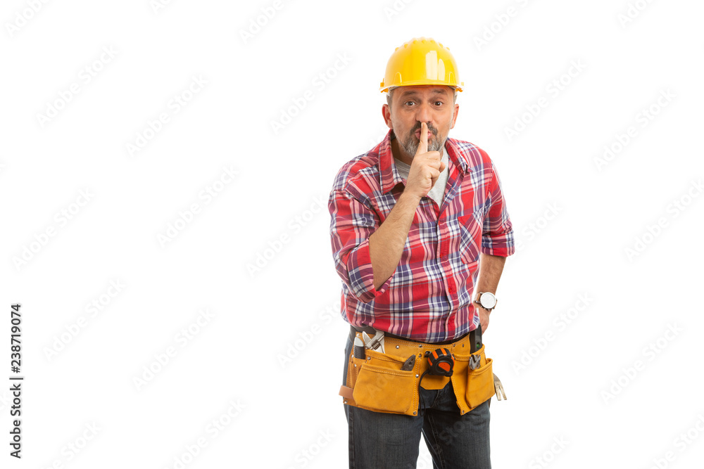 Constructor making shush gesture with finger. Constructor making shush gesture with finger.