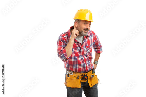 Constructor touching ear as listening sign. © Thunderstock