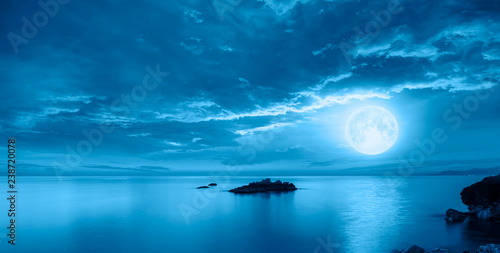 Night sky with moon in the clouds "Elements of this image furnished by NASA © muratart