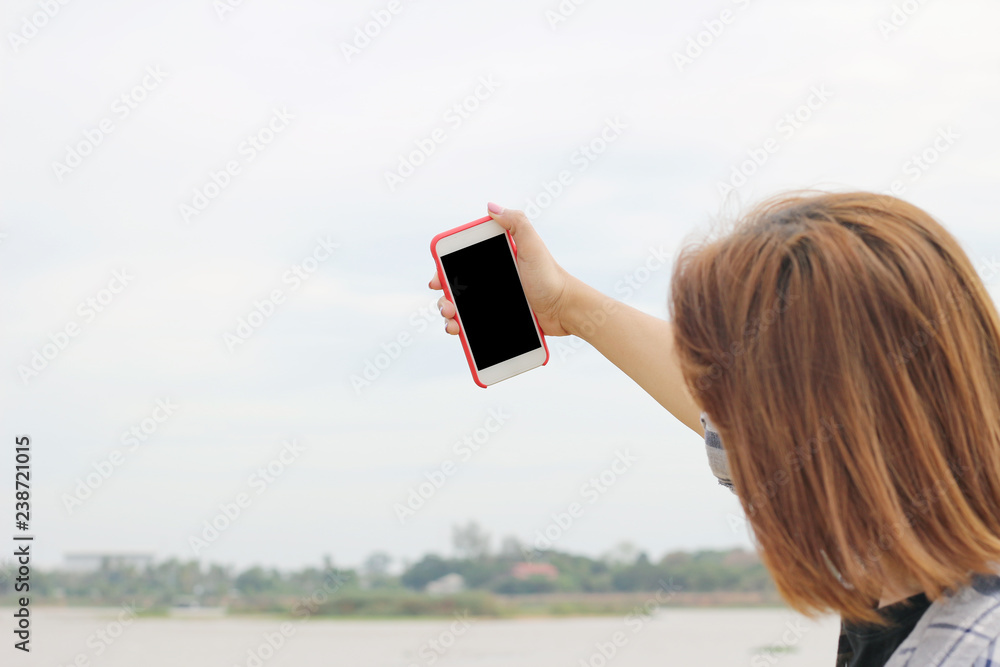 Woman taking self picture, Space for copy. Woman taking self picture, Space for copy.