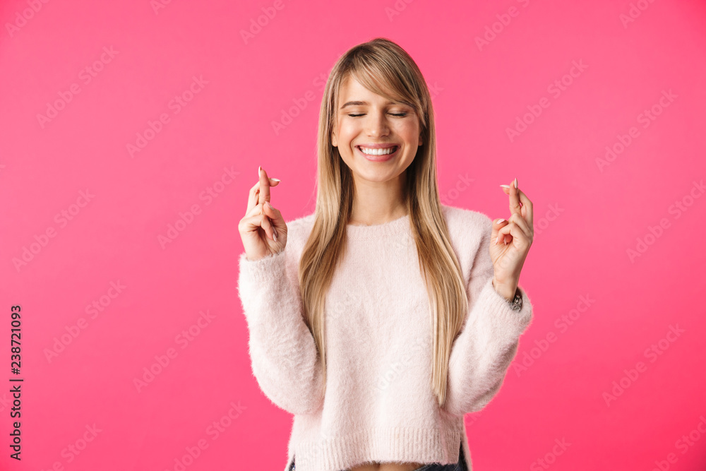 Cheerful young blonde woman wearing sweater Cheerful young blonde woman wearing sweater