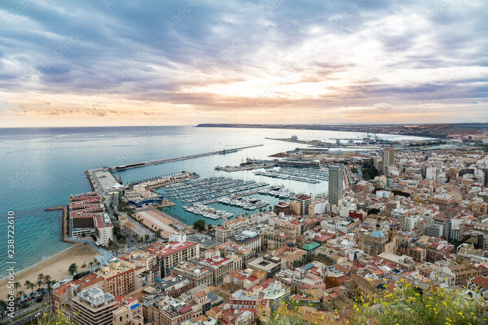 Alicante, Spain. Beautiful landscape of sea and harbor in the blue sea at the mediterranean european sunset from above the Castle of Santa Barbara