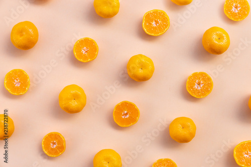top view pattern Background of whole and half oranges on orange background